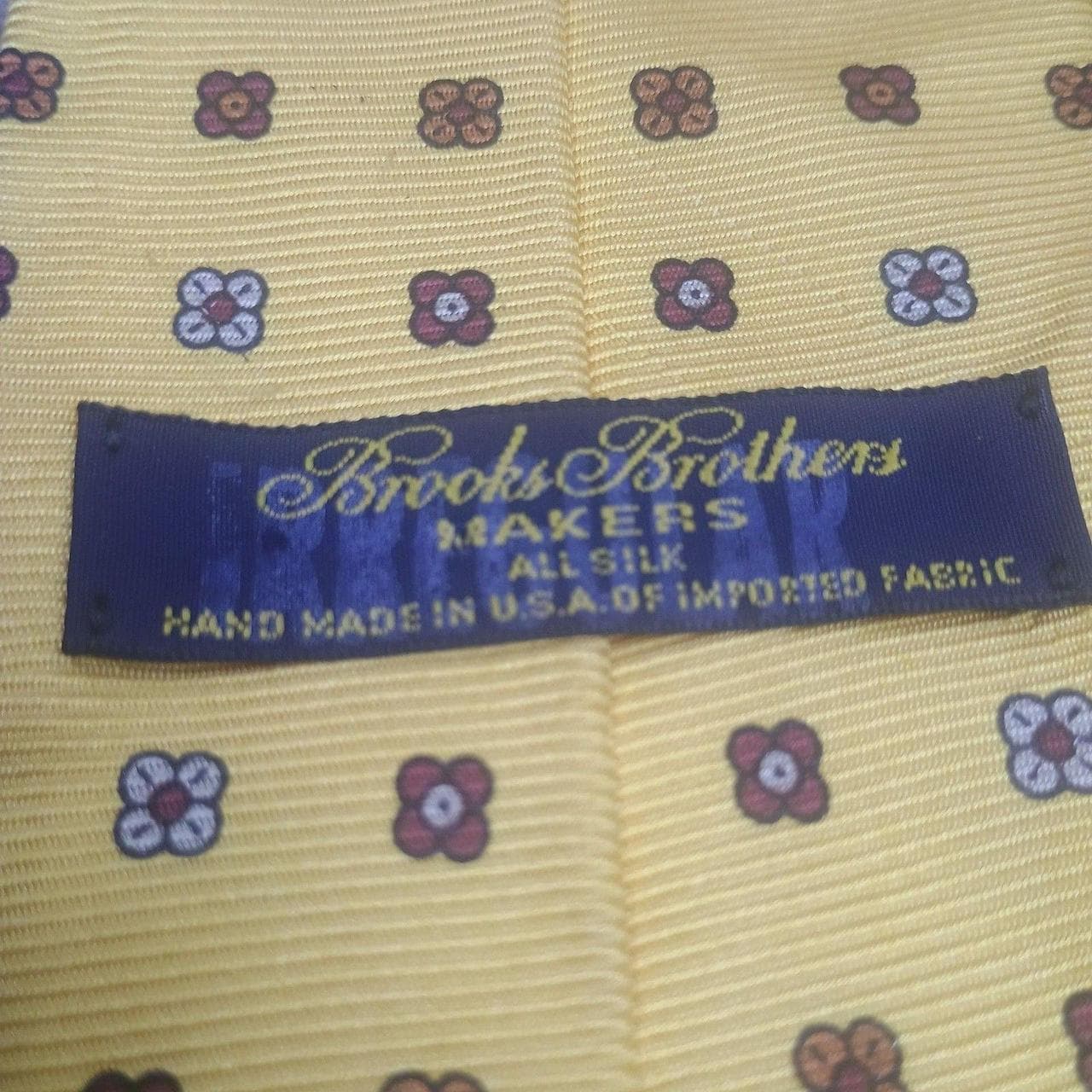 Vintage Brooks Brothers Makers Silk Tie, Yellow Floral Foulard - Made in USA. This classic necktie features a vibrant yellow base with a sophisticated repeating floral foulard pattern in brown and white. Handcrafted from premium 100% silk. - Thumbnail 4