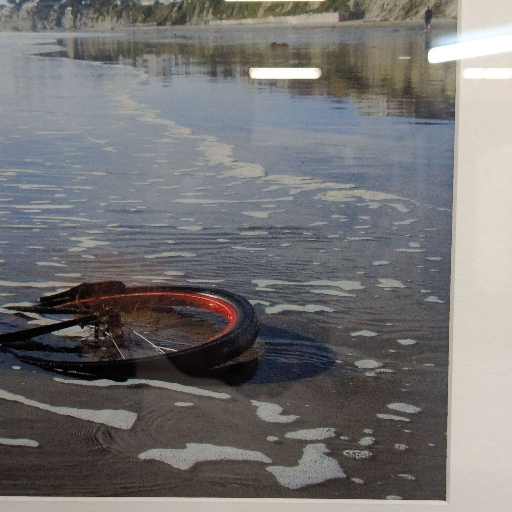 Framed Print – Abandoned Bicycle Wheel on Beach with Scenic View - Thumbnail 2