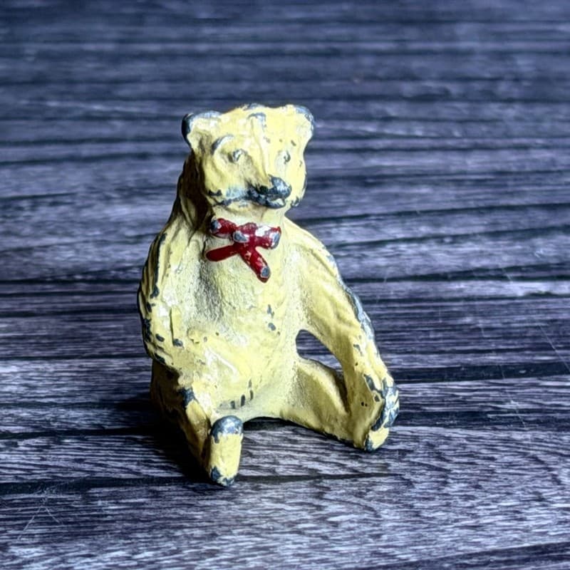 Vintage Miniature Lead Teddy Bear Figurine, Sitting Yellow Bear with Red Bow, 1"