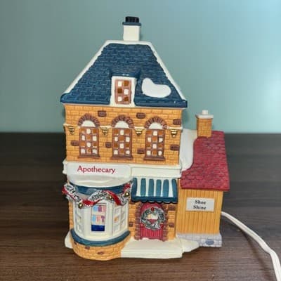 Dickensville Collectables NOMA Apothecary Shoe Shine Porcelain Lighted House