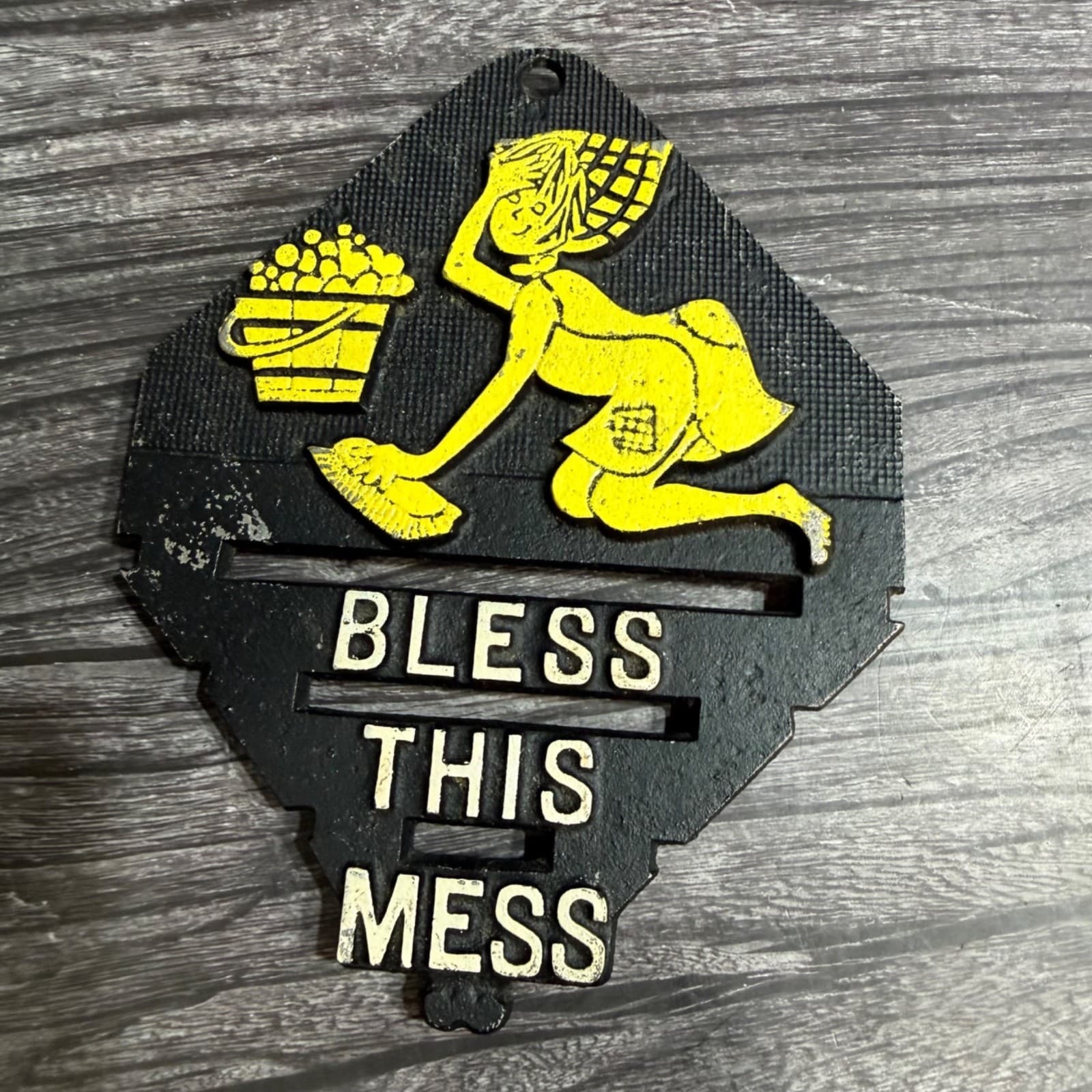 Vintage Cast Iron Trivet "Bless This Mess" Wall Plaque With Yellow Cleaning Lady