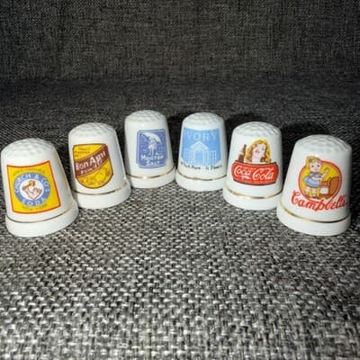 6 Porcelain Thimbles- Morton salt, Campbells, Coca Cola, Bon Ami, A&H and Ivory