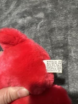 A vintage red plush teddy bear with a heart nose and ribbon. - Thumbnail 6