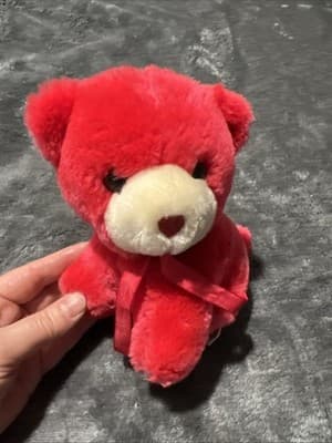 A vintage red plush teddy bear with a heart nose and ribbon. - Thumbnail 7
