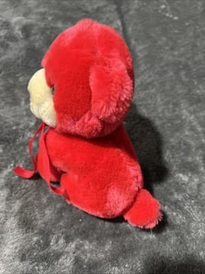 A vintage red plush teddy bear with a heart nose and ribbon. - Thumbnail 3