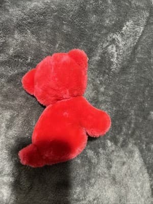 A vintage red plush teddy bear with a heart nose and ribbon. - Thumbnail 4