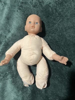 A Soft-bodied Baby Doll with Vinyl Head and Limbs Showing Wear. Vintage 1960s