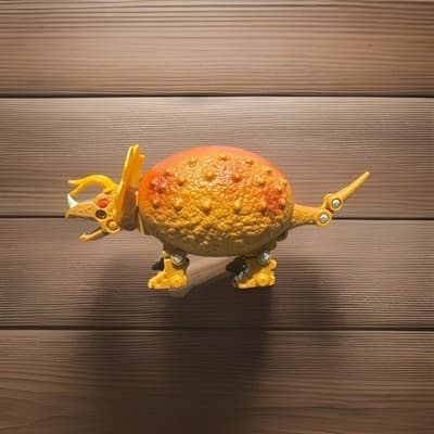 Transforming Triceratops Dinosaur Action Figure Plastic Orange Yellow