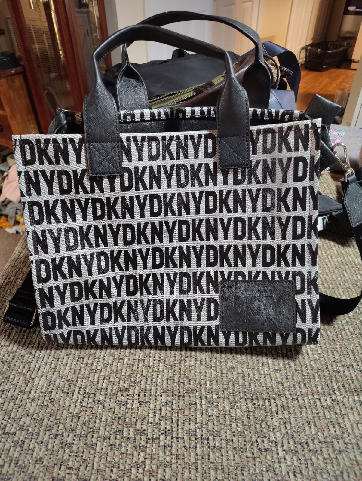 DKNY Hadlee tote bag featuring an all-over logo-print and a black leather Patch