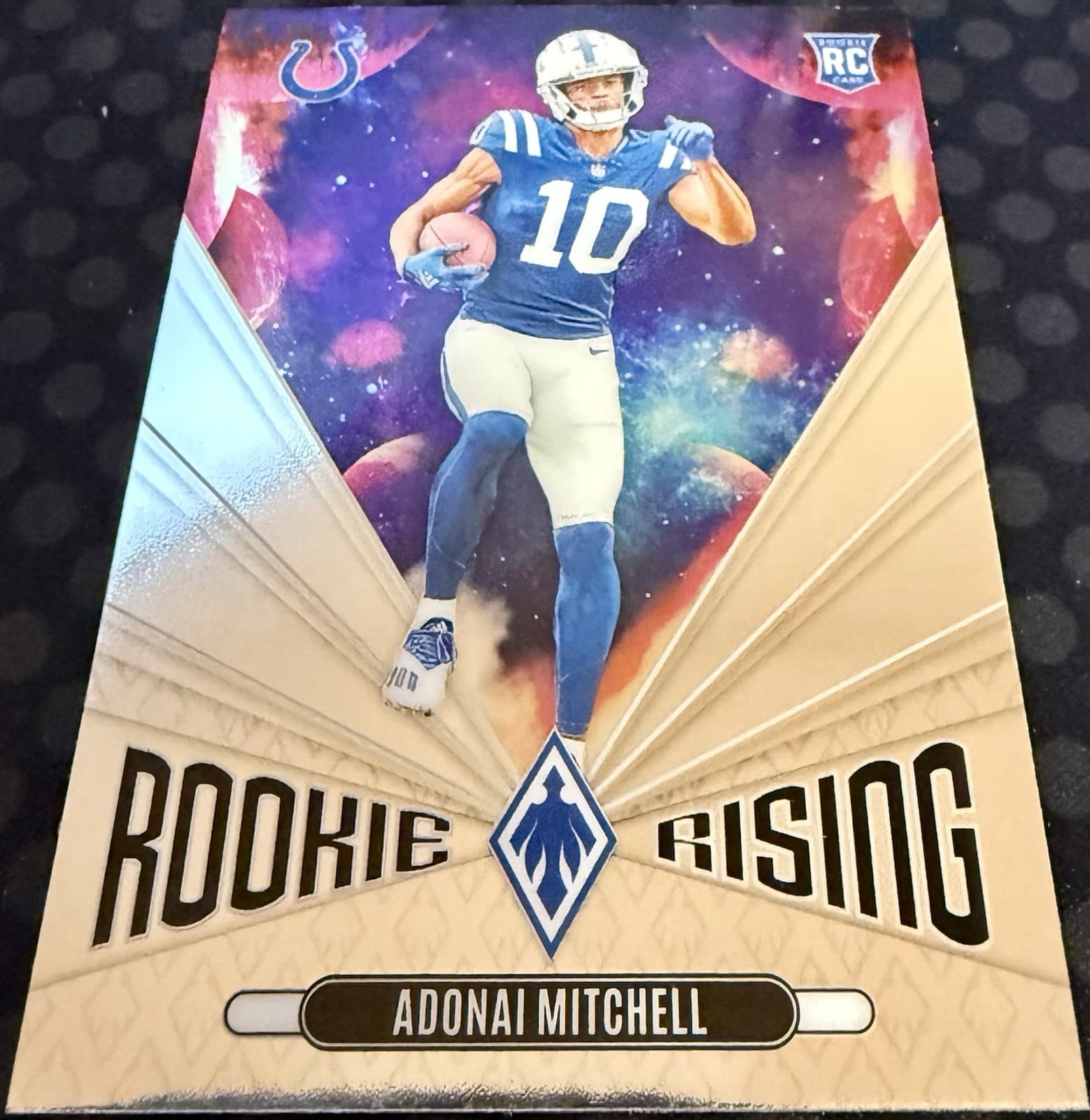 2024 Panini Phoenix Adonai Mitchell Rookie Rising Galaxy Silver #RR-AML