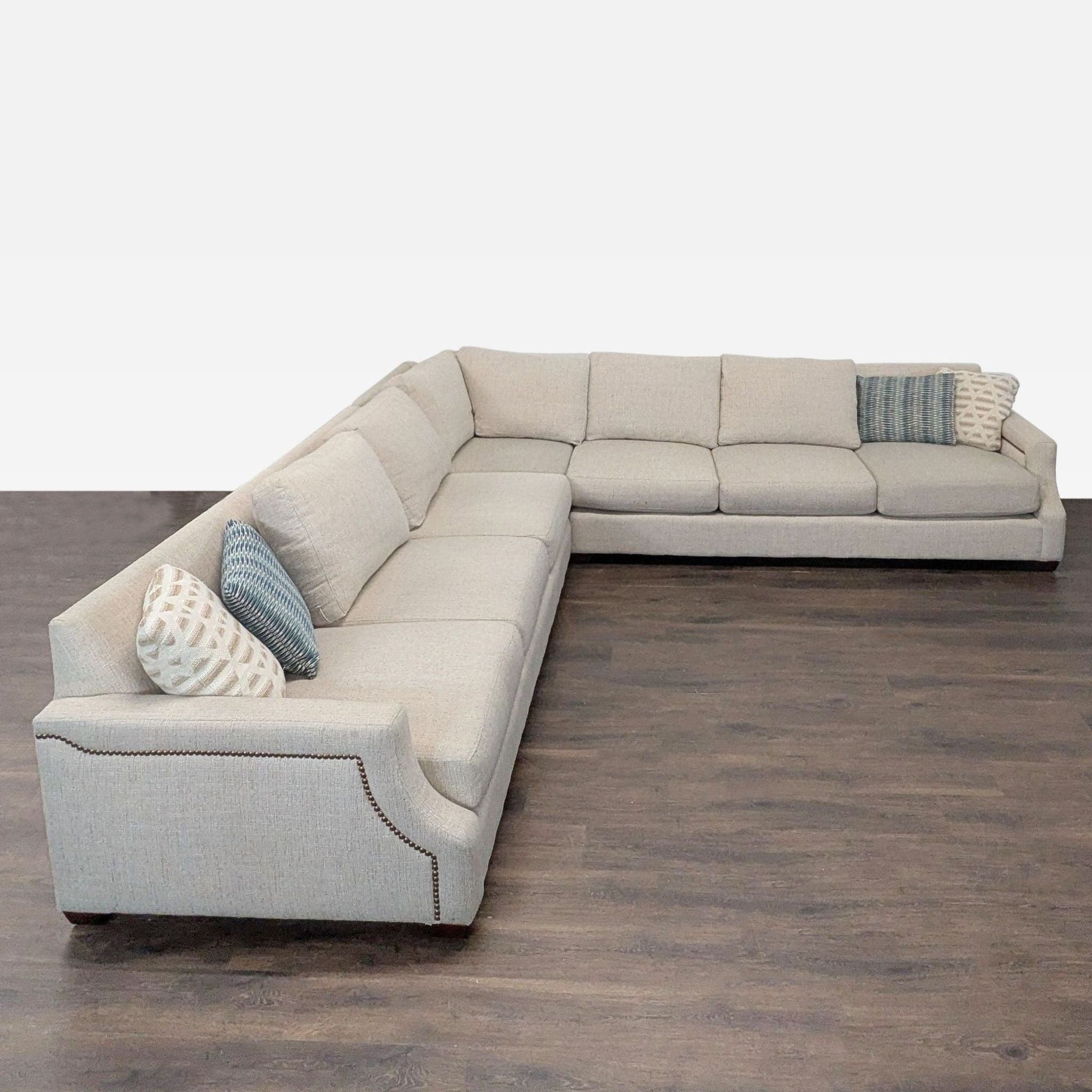 Havertys Baldwin Beige Sectional Sofa with Nailhead Trim and Accent Pillows