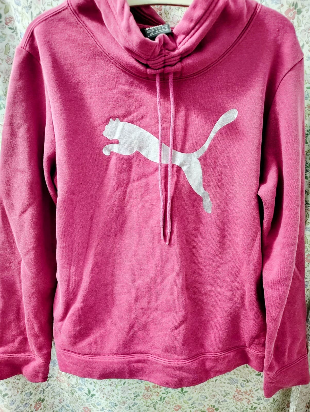 magenta Puma cinch-up cat logo hoodie featuring a unique rolled drawstring neck