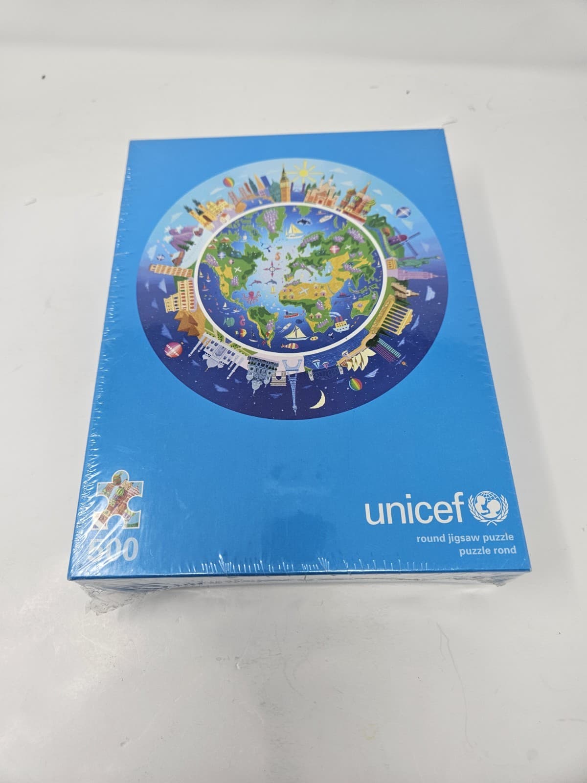 RARE 2009 UNICEF Round 500 Jigsaw Puzzle Around The World By Stephen Waterhouse - Thumbnail 3