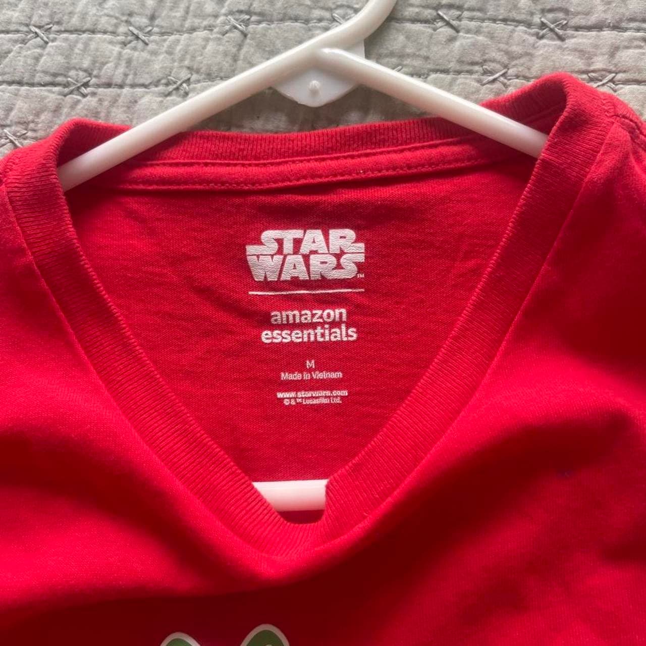 Celebrate the holidays with a galactic twist in this officially licensed Star Wars Christmas long sleeve T-shirt. Featuring an AT-AT Walker carrying a stack of Christmas presents and the festive phrase “Merry Force Be With You,” this bright red tee is perfect for Star Wars fans during the holiday season. - Thumbnail 3