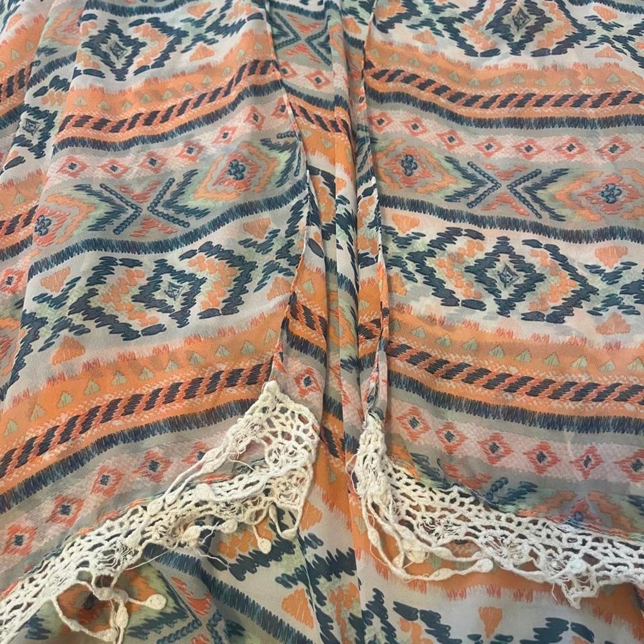 Orange, blue, and white geometric patterned poncho with crochet trim #boho #festival #poncho #cardigan - Thumbnail 2