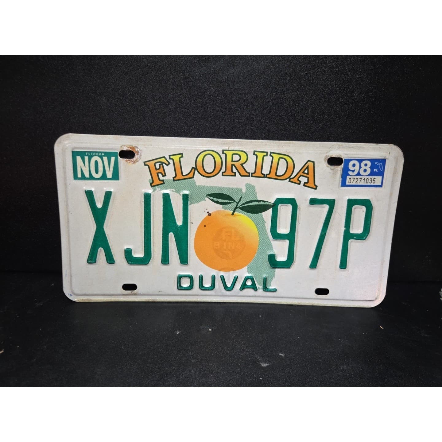 Florida License Plate XJN 97P, Duval County, Orange Graphic, Vintage 1998