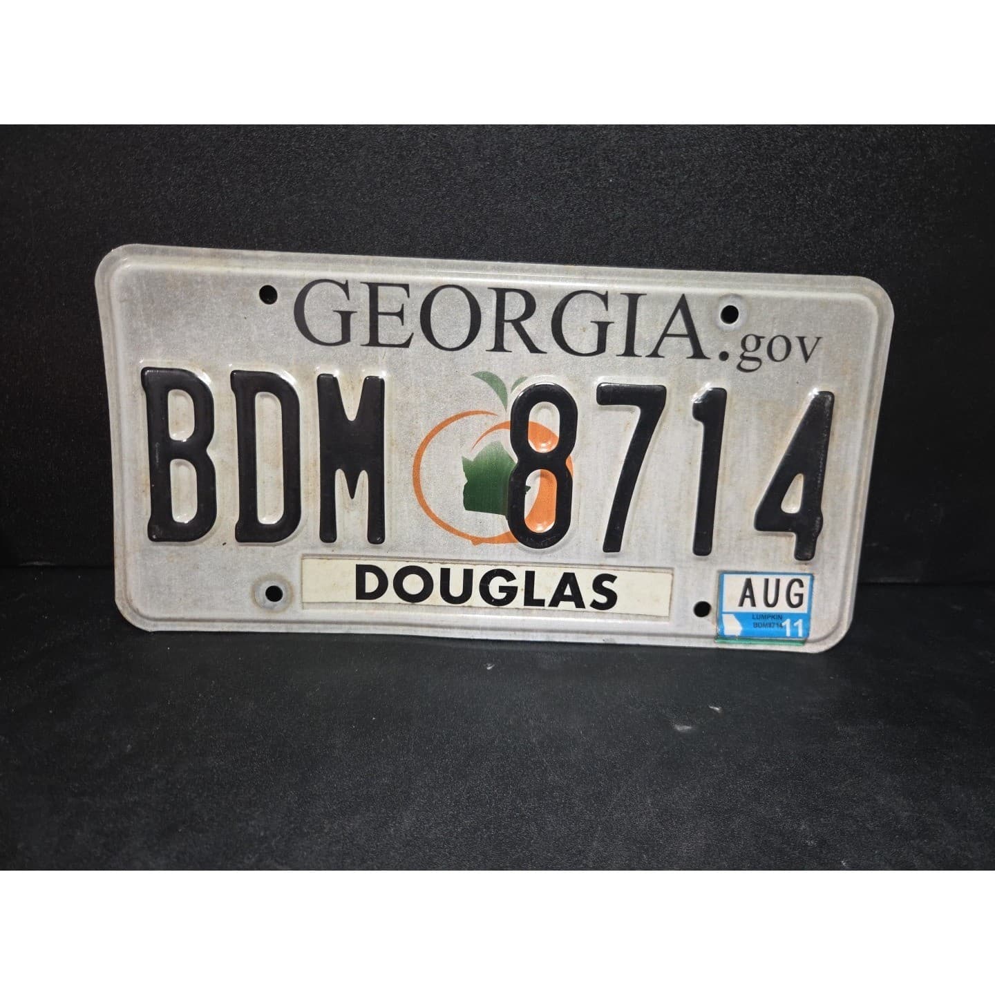 Georgia License Plate BDM 8714, Douglas County, Peach Graphic, Aug 2011 GA Tag