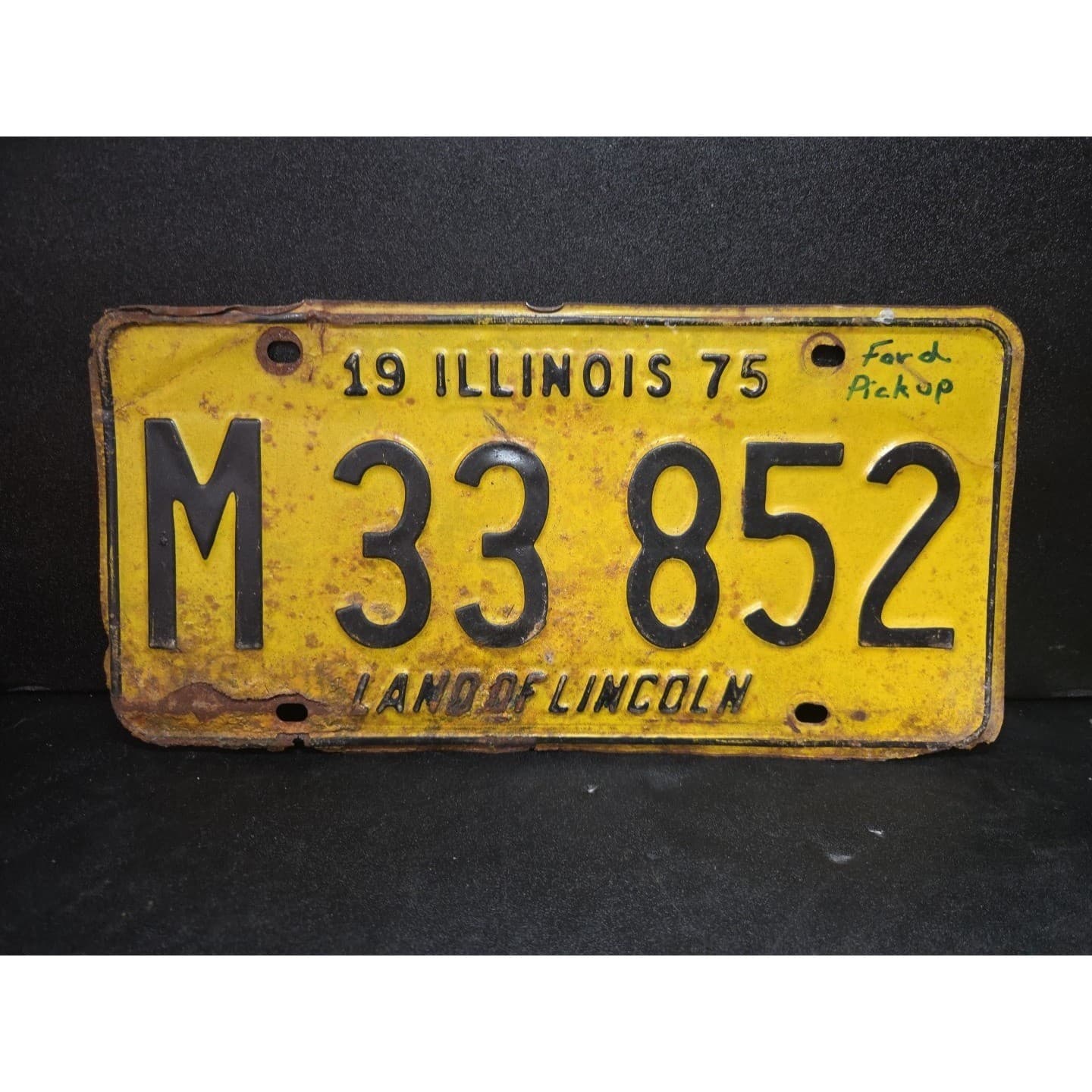 Illinois License Plate M 33 852, Land of Lincoln, Yellow Black Rustic, 1975