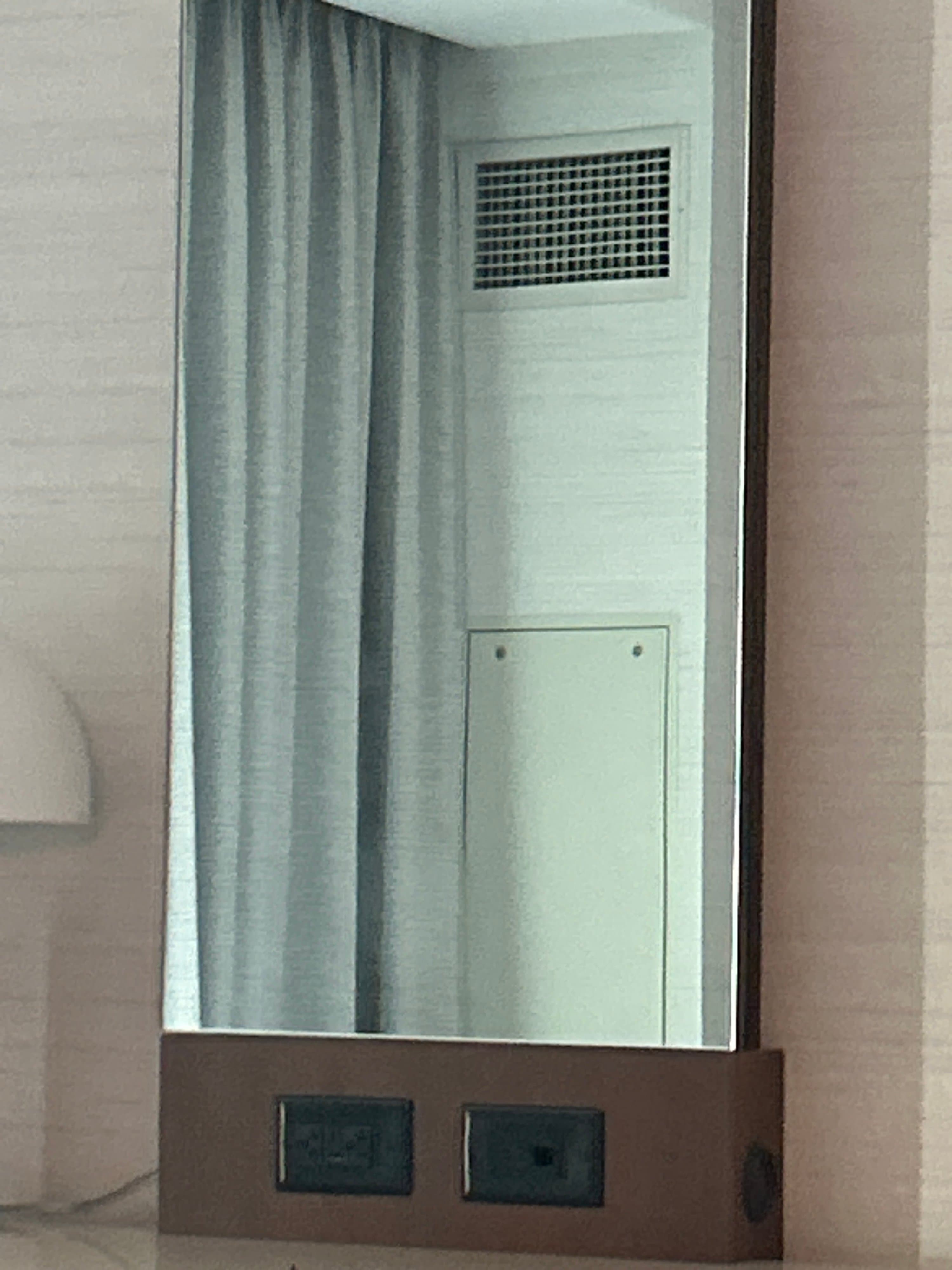 Wall-Mounted Mirror with Integrated Power Outlets