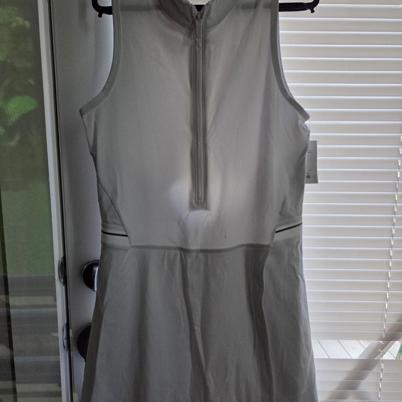 White FLX tennis dress with green trim #tennis #athletic and a small stain. new with tag - Thumbnail 2