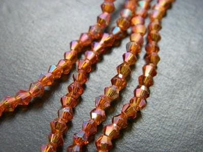 Crafting Glass Beads, Orange Red Bicone (3mm Strand, 18 Inch) - Image 1