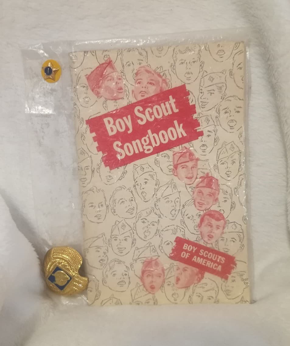1950s Cub Scout Lot: 1956 BSA Songbook, Wolf Slide (Clasp Back) & Service Star - Image 1