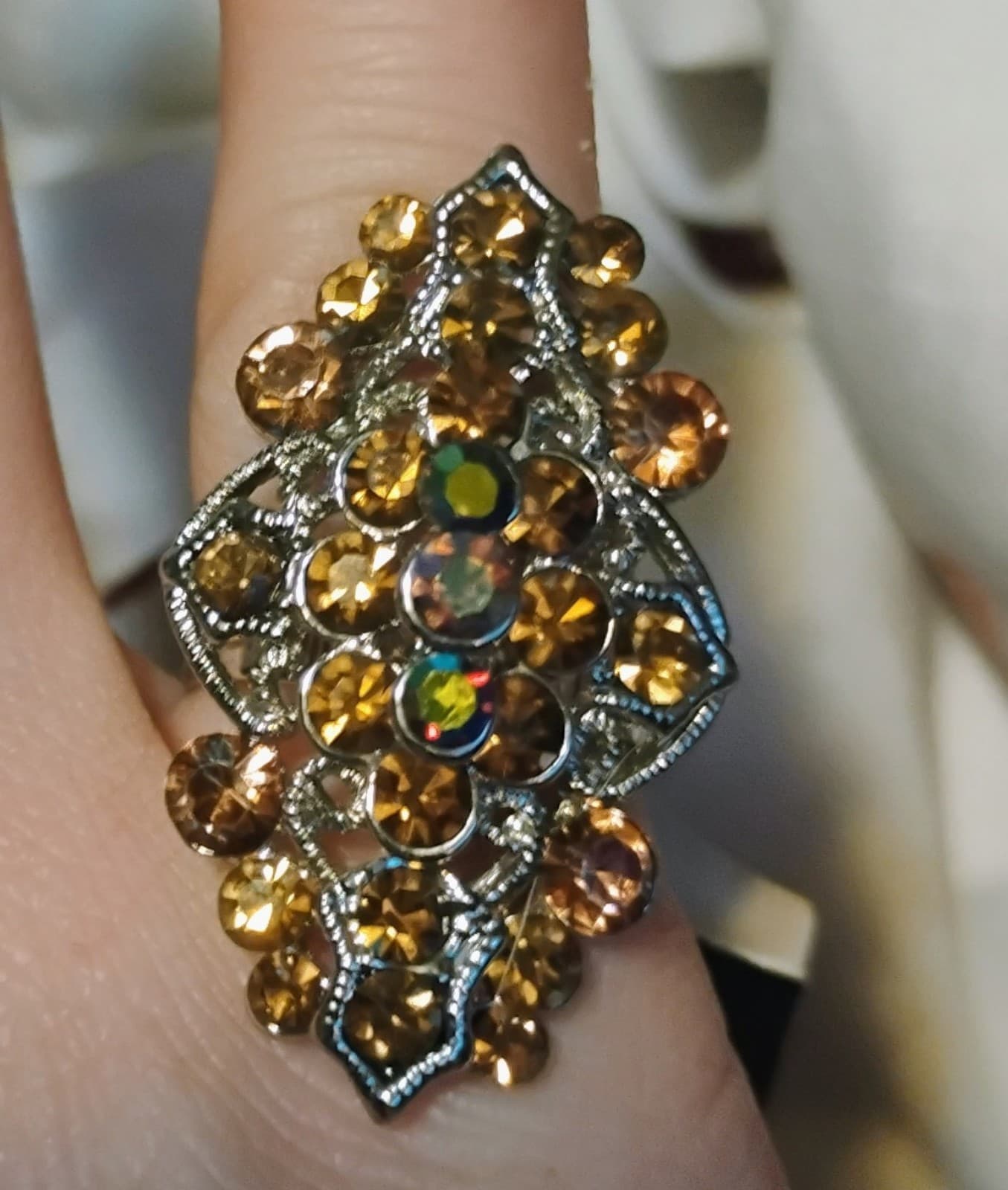 Silver-toned adjustable ring with orange glass rhinestones - Image 1