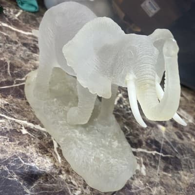 frosted glass elephant sculpture With White Tusks 10” Long 8” Tall And 4” Wide - Image 1
