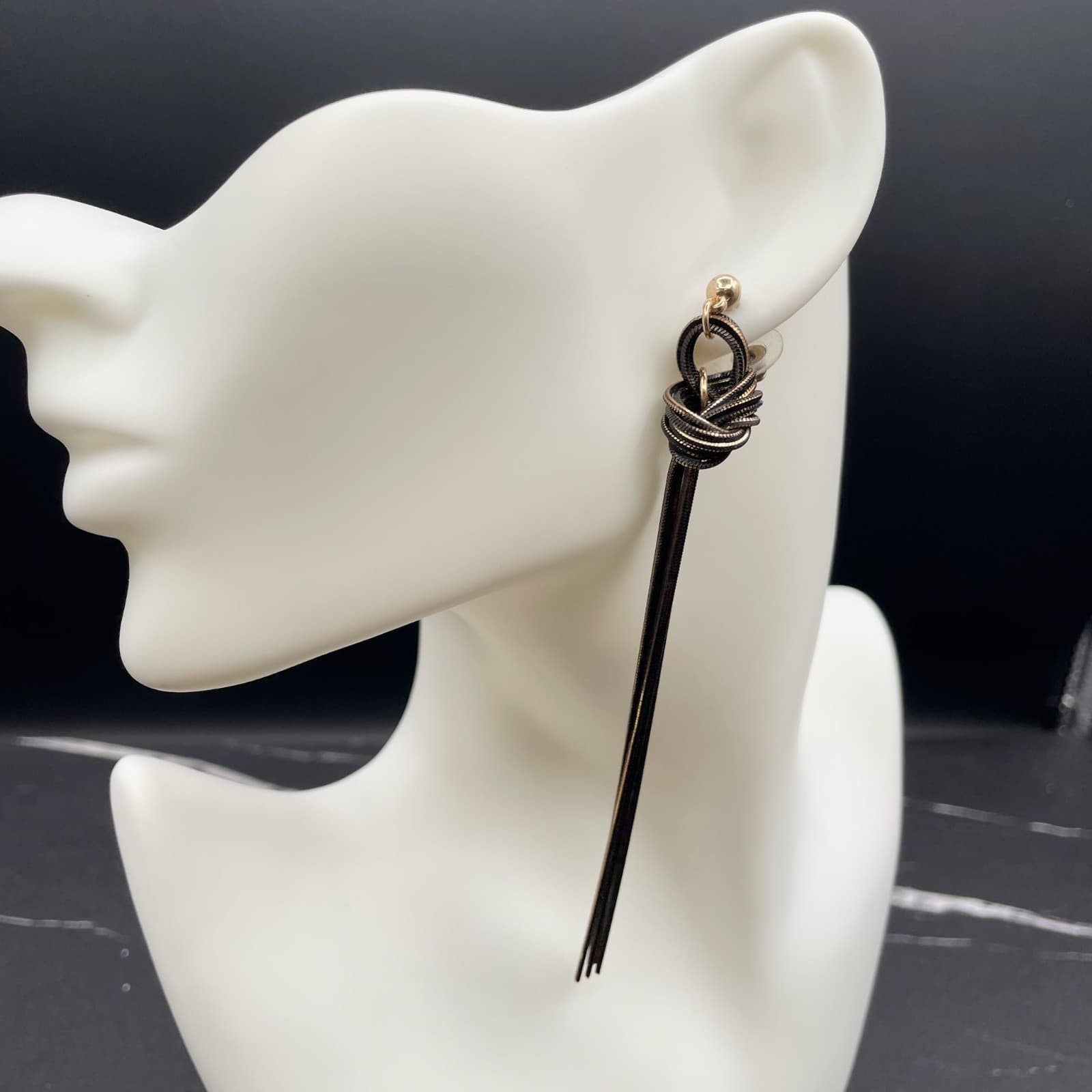 Contemporary Gold-Tone Black Snake Chain Knotted Linear Tassel Drop Earrings - Image 1