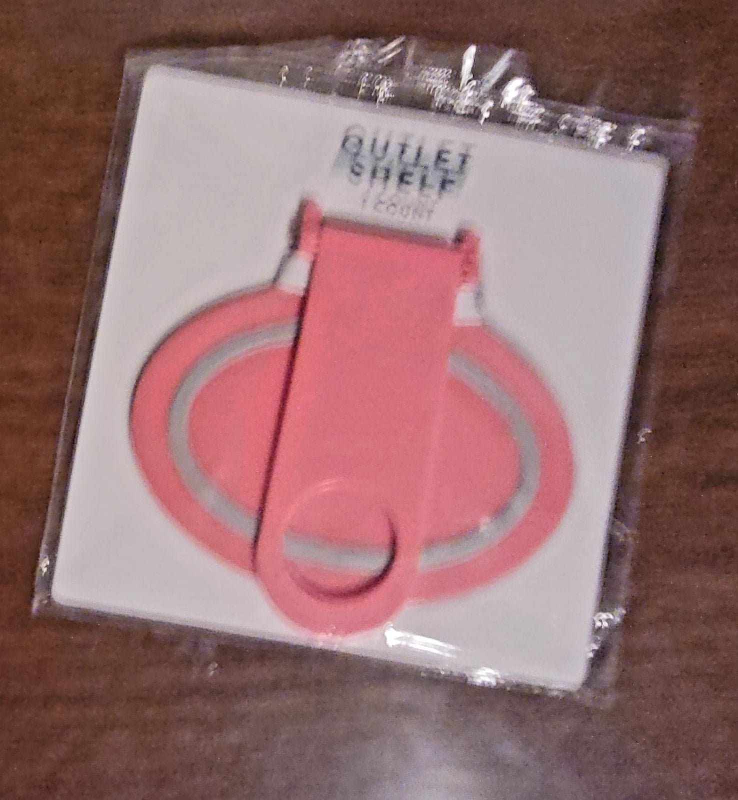 Universal outlet shelf for mobile phone