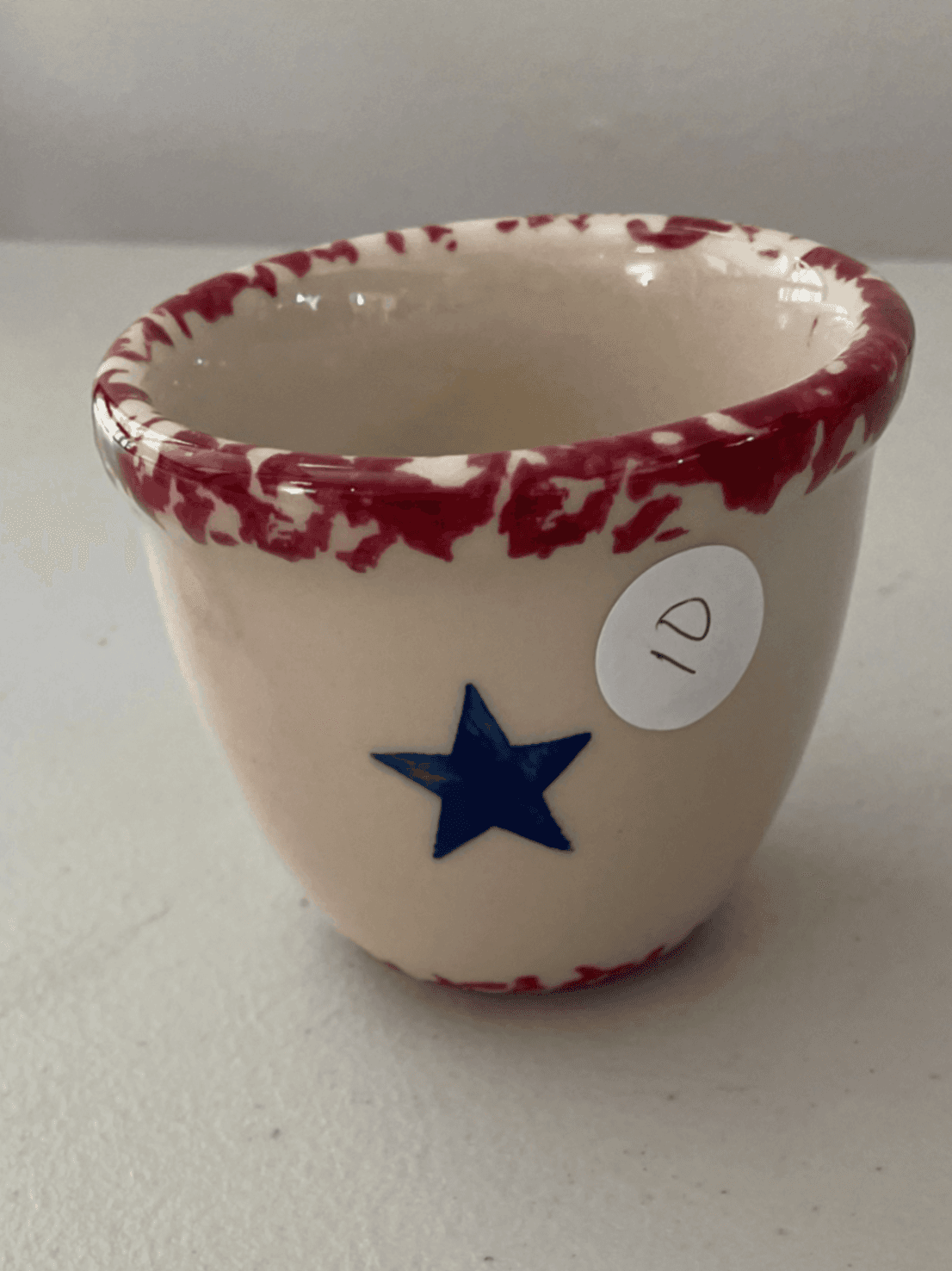 Ceramic Mug with Red Rim and Blue Star Design