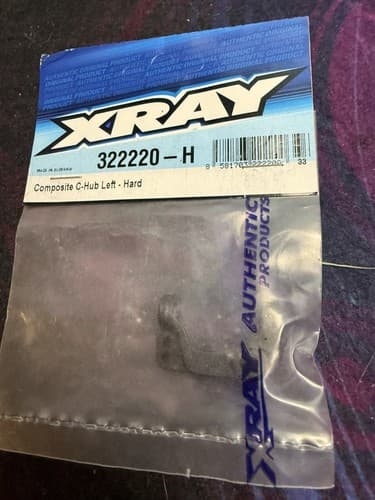 XRAY 322220-H - Composite Left C-Hub 0 Degree, Hard - Image 1