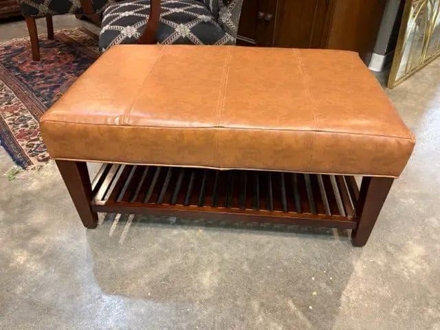 Camel Faux Leather Ottoman With Wooden Base And Shelf - Image 1