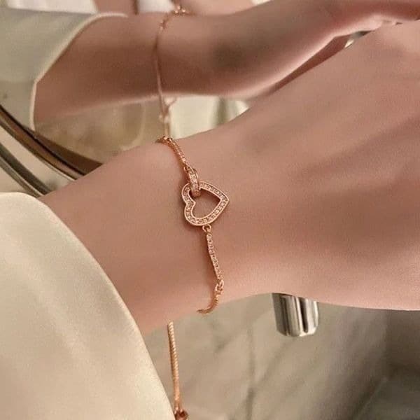 The Rose Gold Heart Chakra Slide Closure bracelet with heart pendant. - Image 1