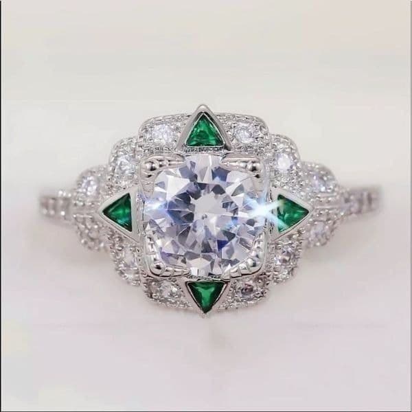 The Welcome To Oz silver and white sapphire cocktail ring w emerald accents - Image 1