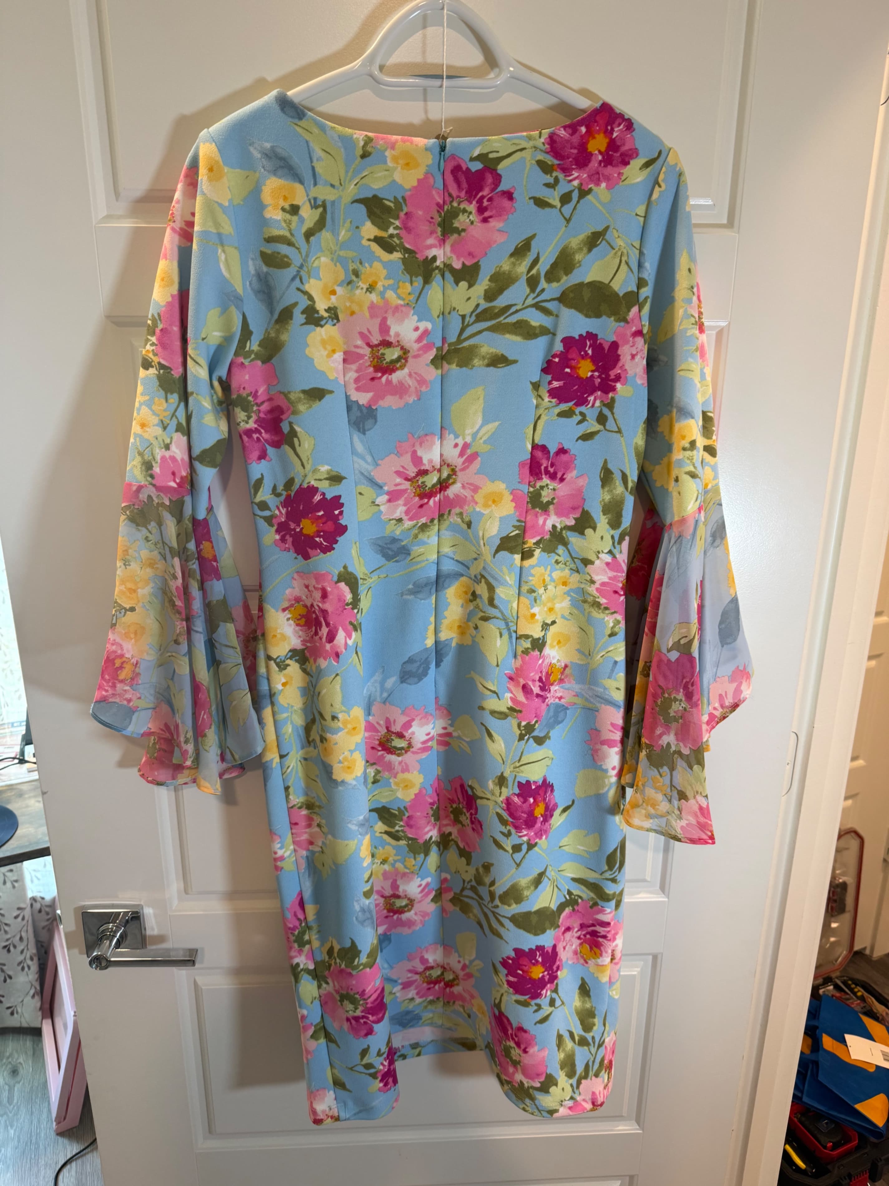 Shelby & Palmer Floral Bell Sleeve Dress with Blue Background - Image 1