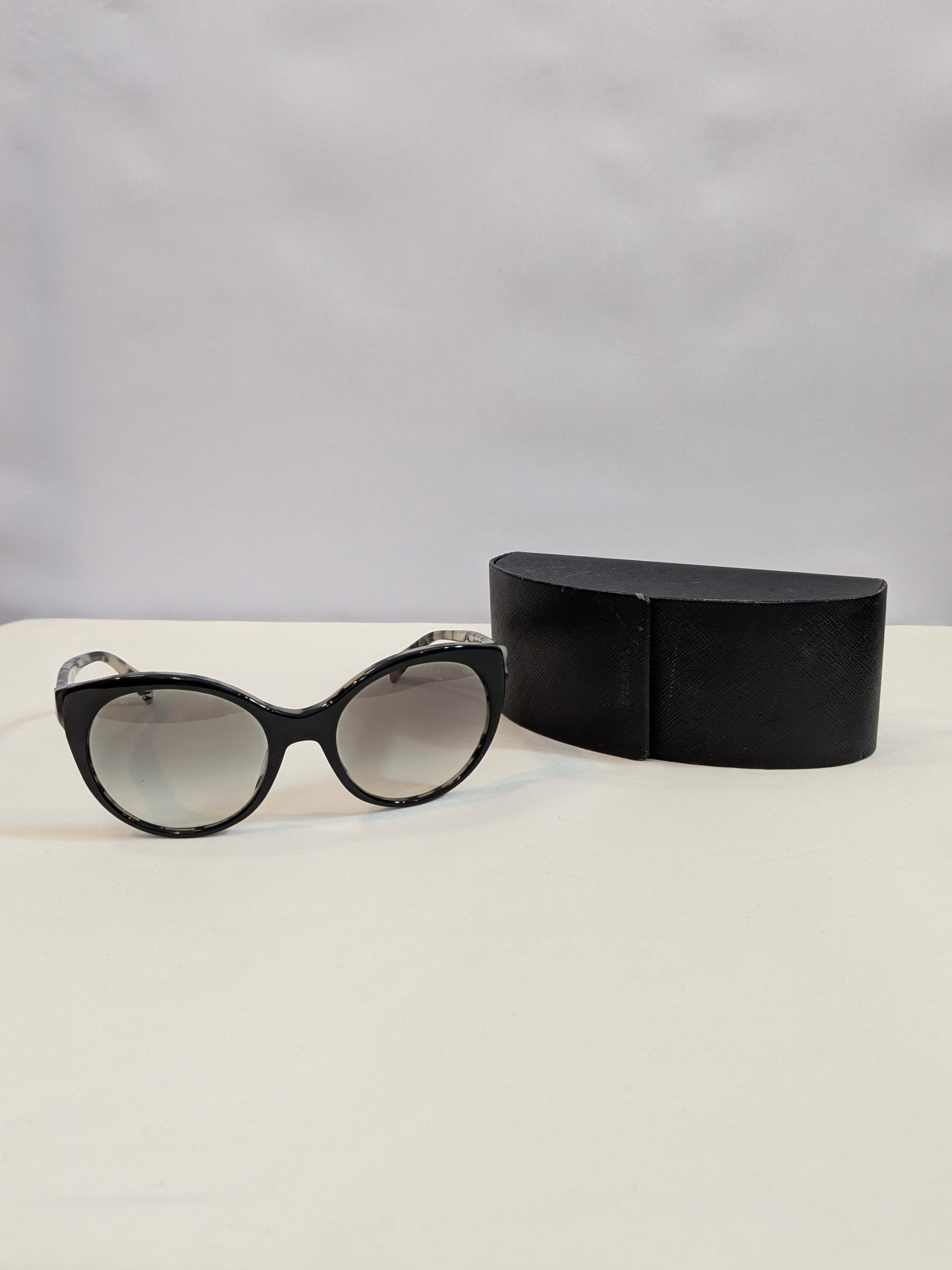Prada SPR23O Black and Ivory Marble Cat-Eye Sunglasses with Gray Gradient Lenses