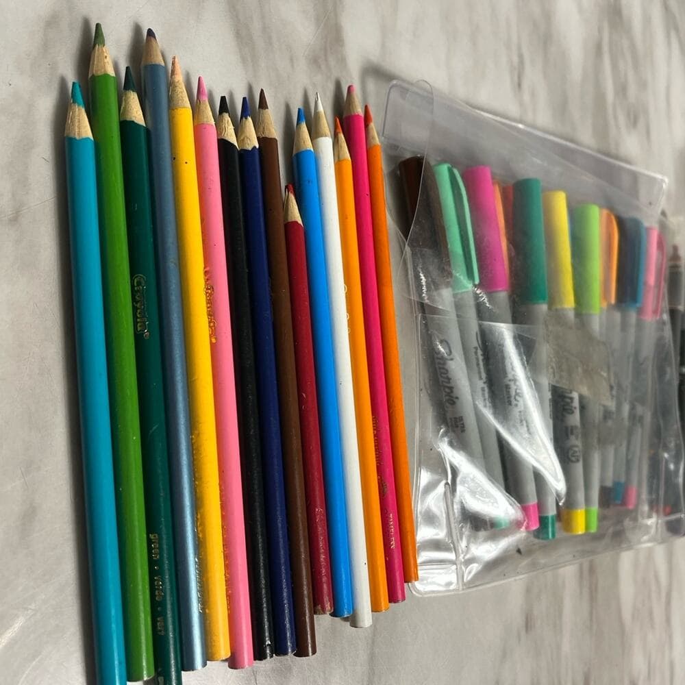 A Bundle Of Color Pencils & Markers