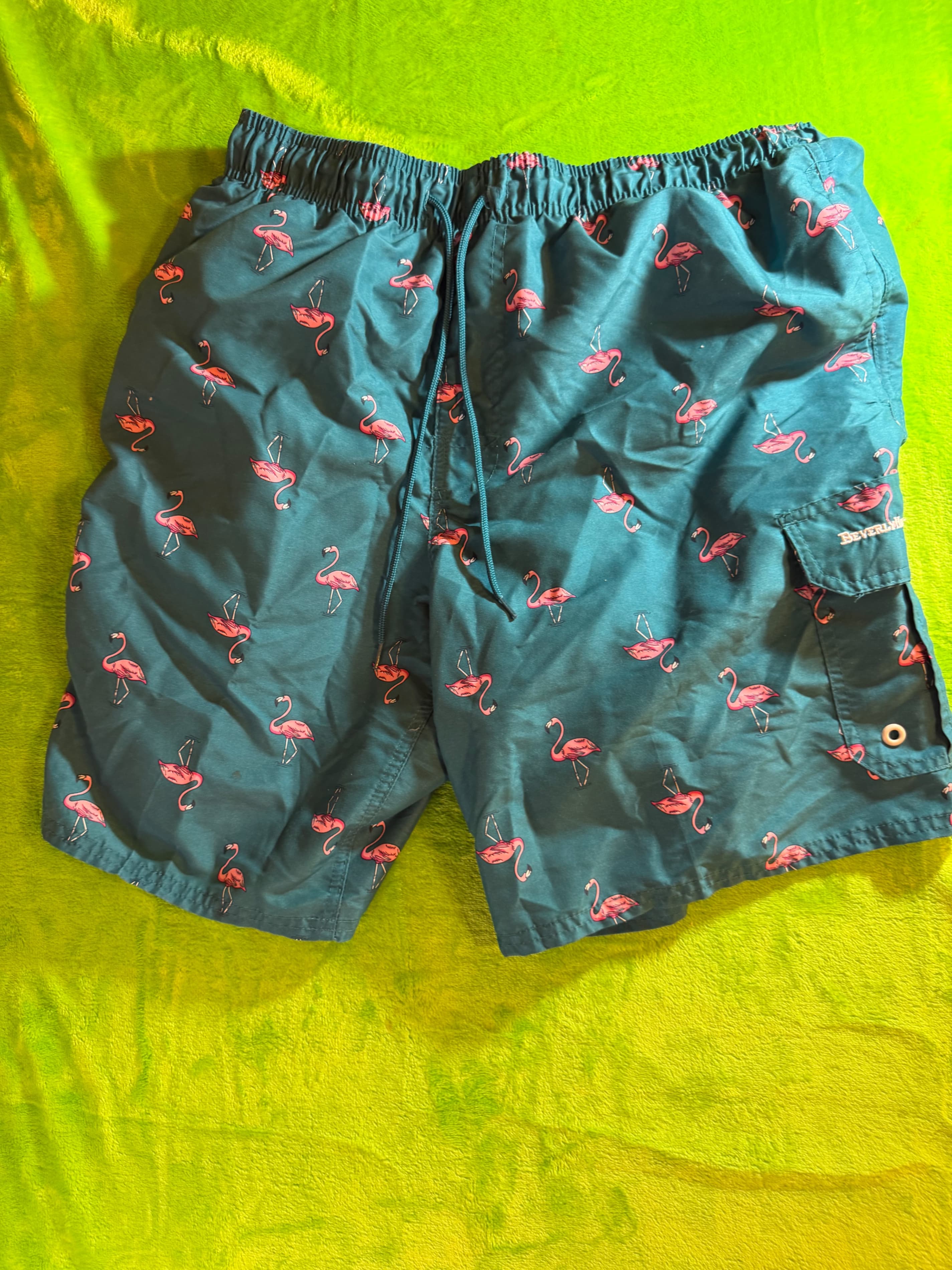 Beverly Hills Polo Club men's blue swim trunks with a pink flamingo pattern L