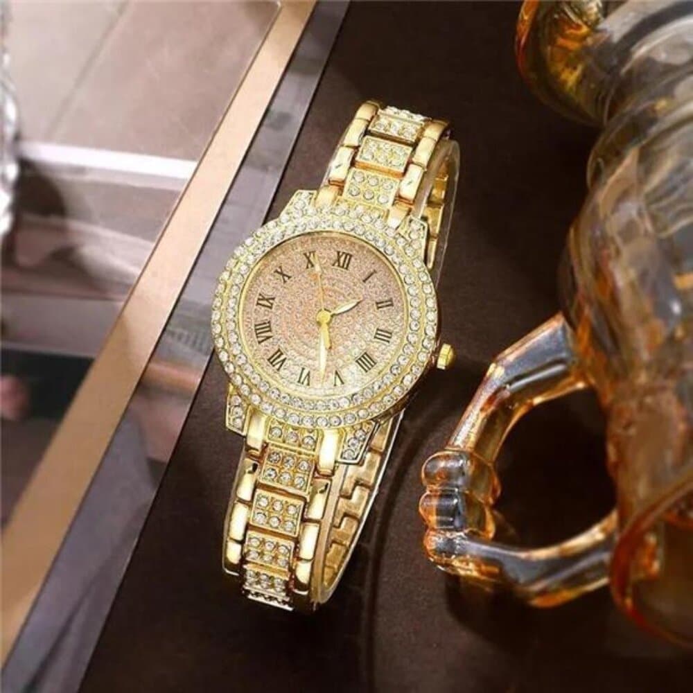 Set of Jewelry Including a Golden Watch, Ring, Necklace, Earrings