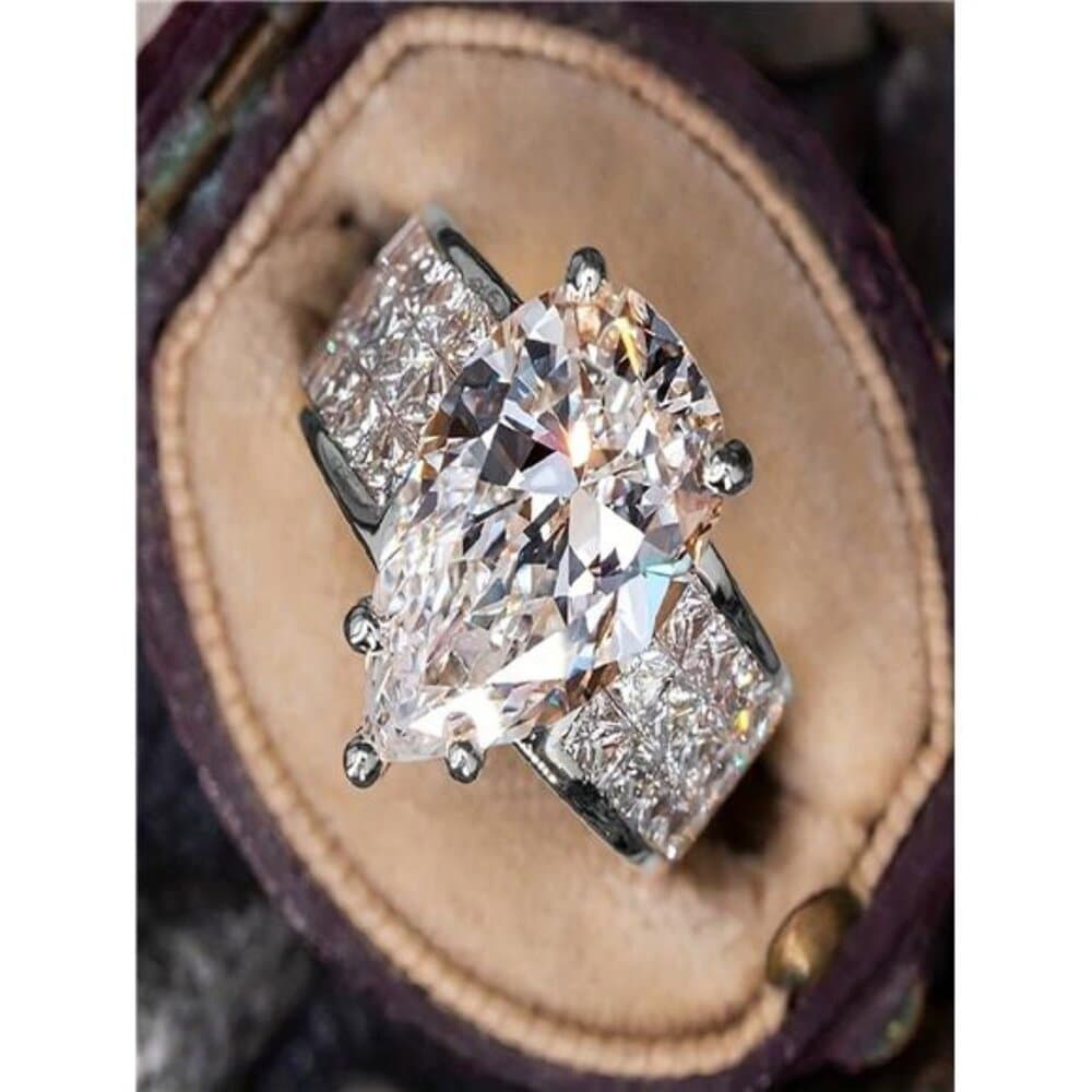 An Elegant Silver-Plated Ring With A Large, Shimmering Stone, Suitable For