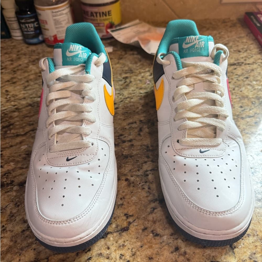 Air Force 1 '07 Low sneakers in a White, Racer Pink, and Thunder Blue colorway