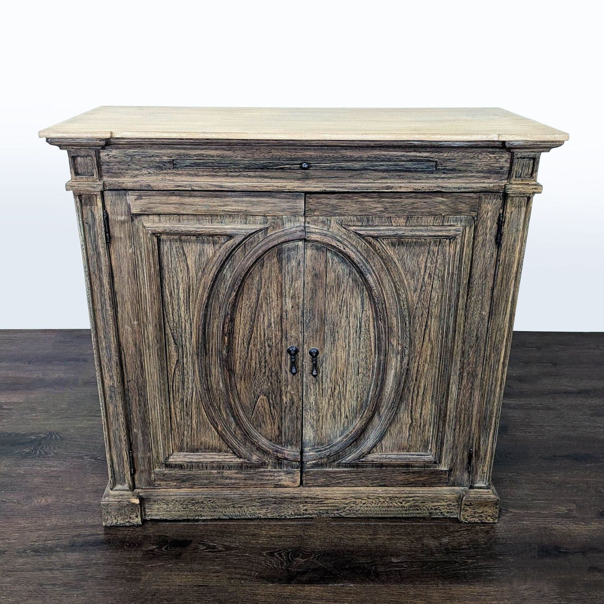 Two Door Cabinet with Molded Designs on Doors