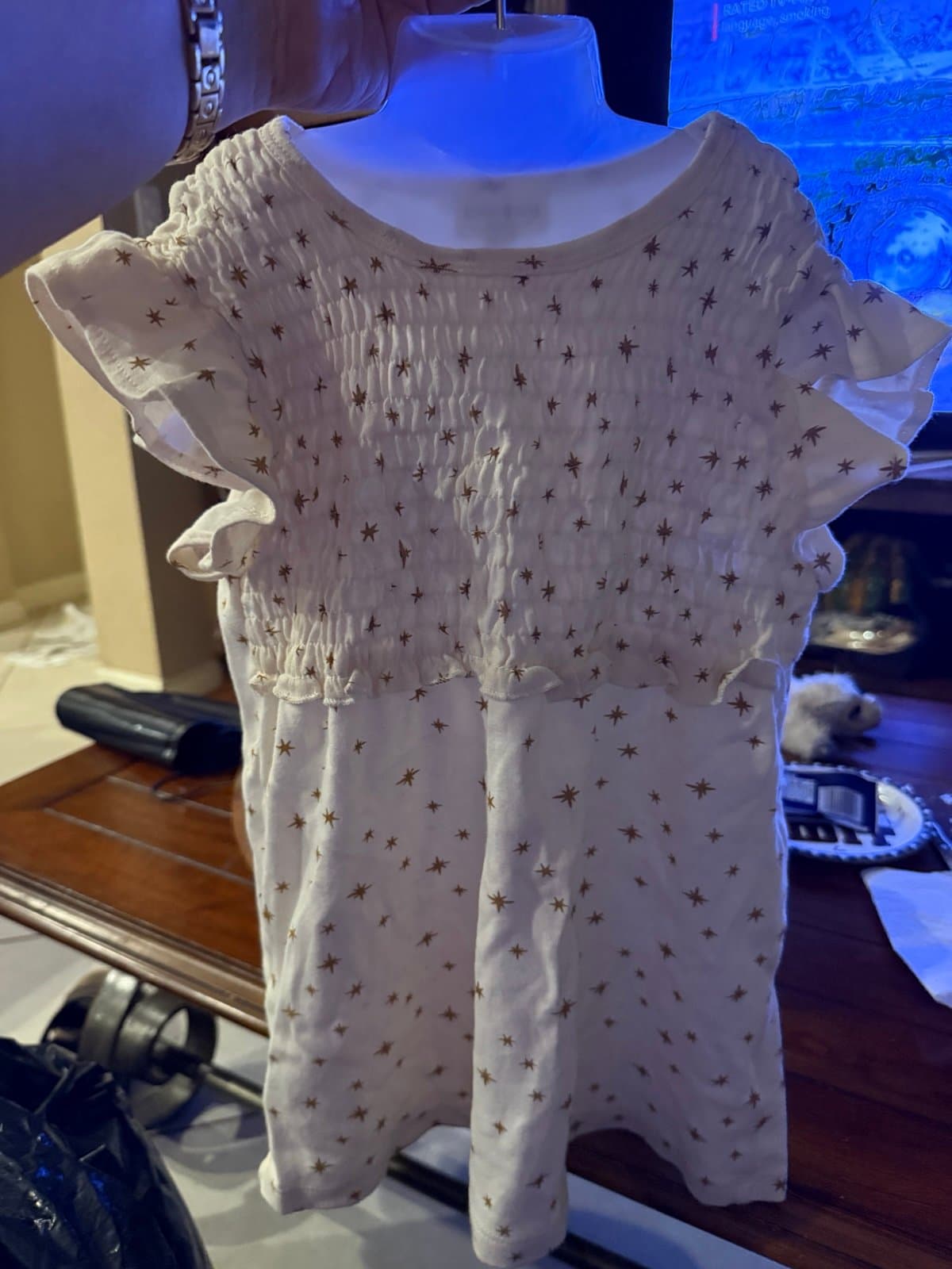 White smocked top with gold stars