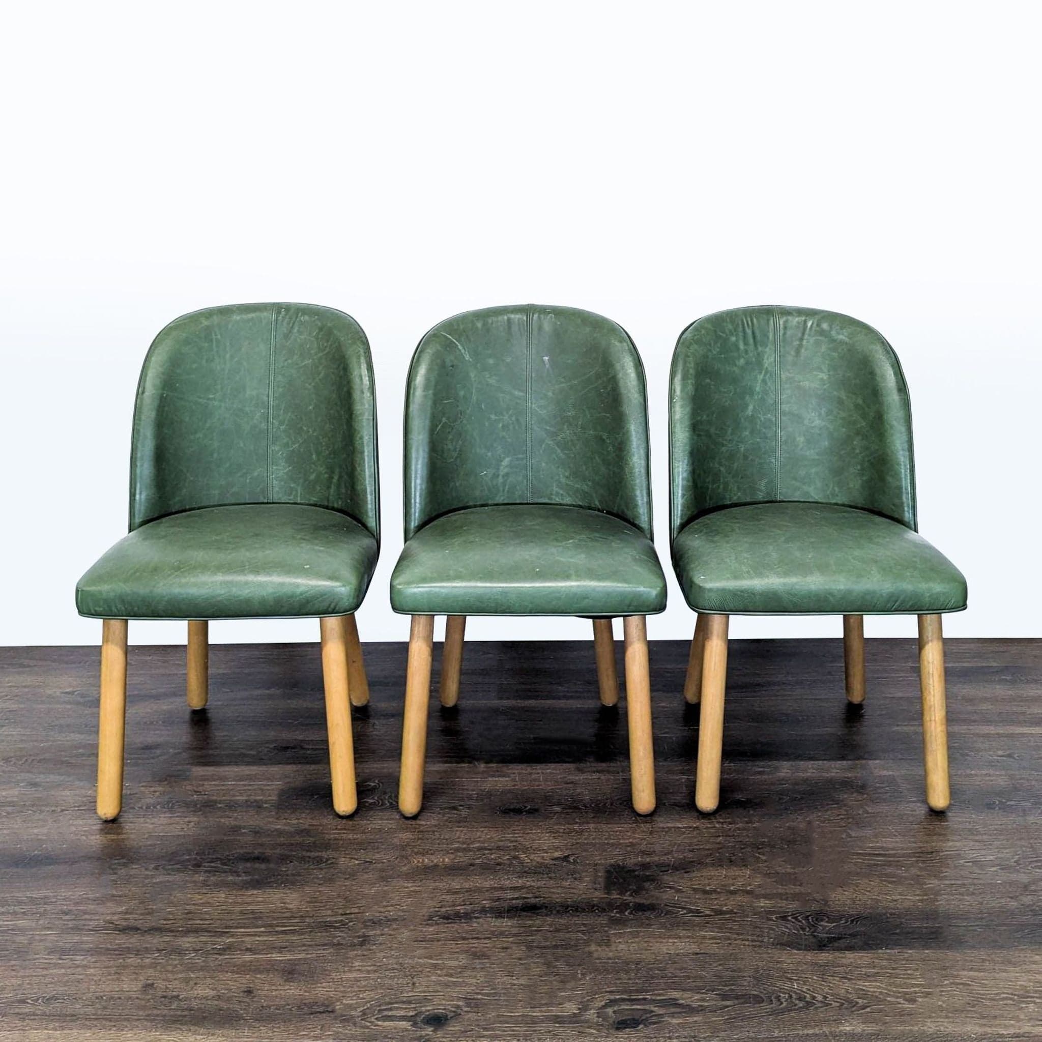 Set of Three Leather Dining Chairs on Wood Legs