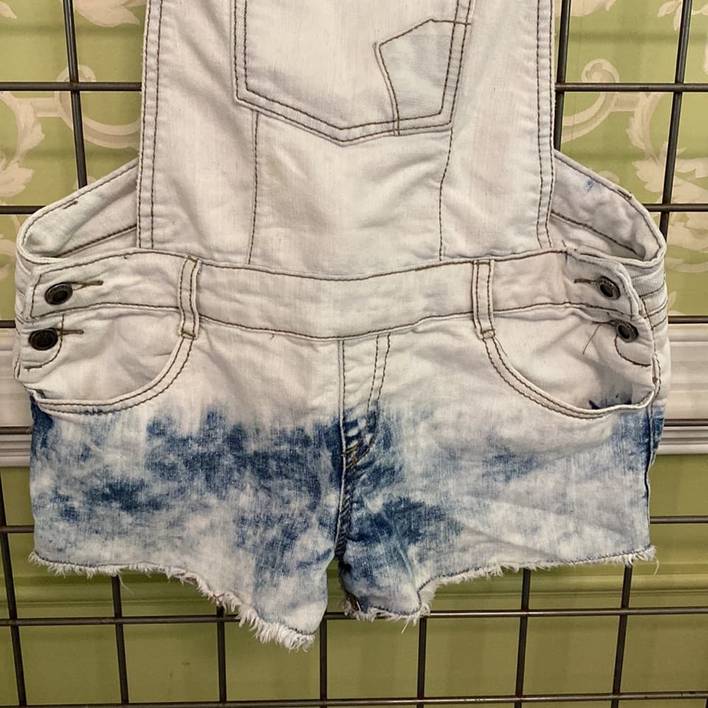 Faded jean overalls