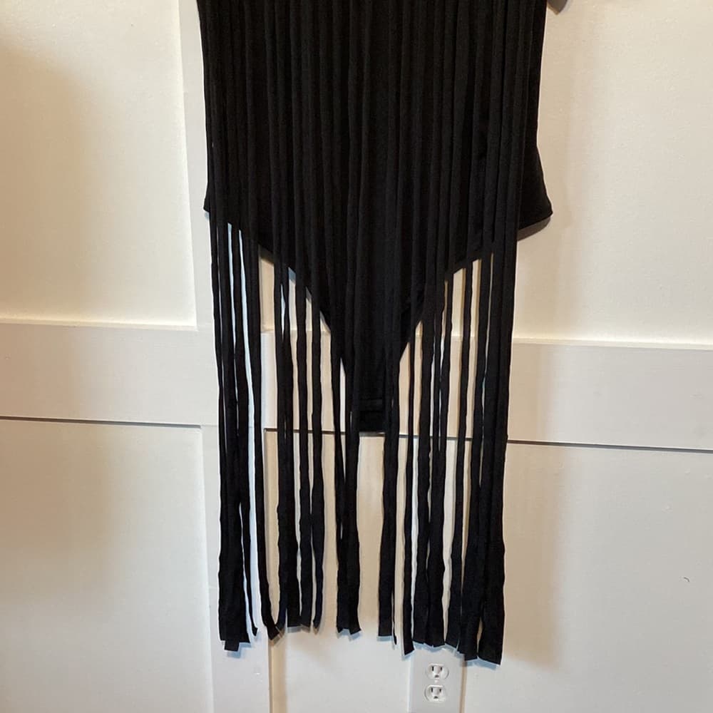 Black bodysuit with fringe accents on the front