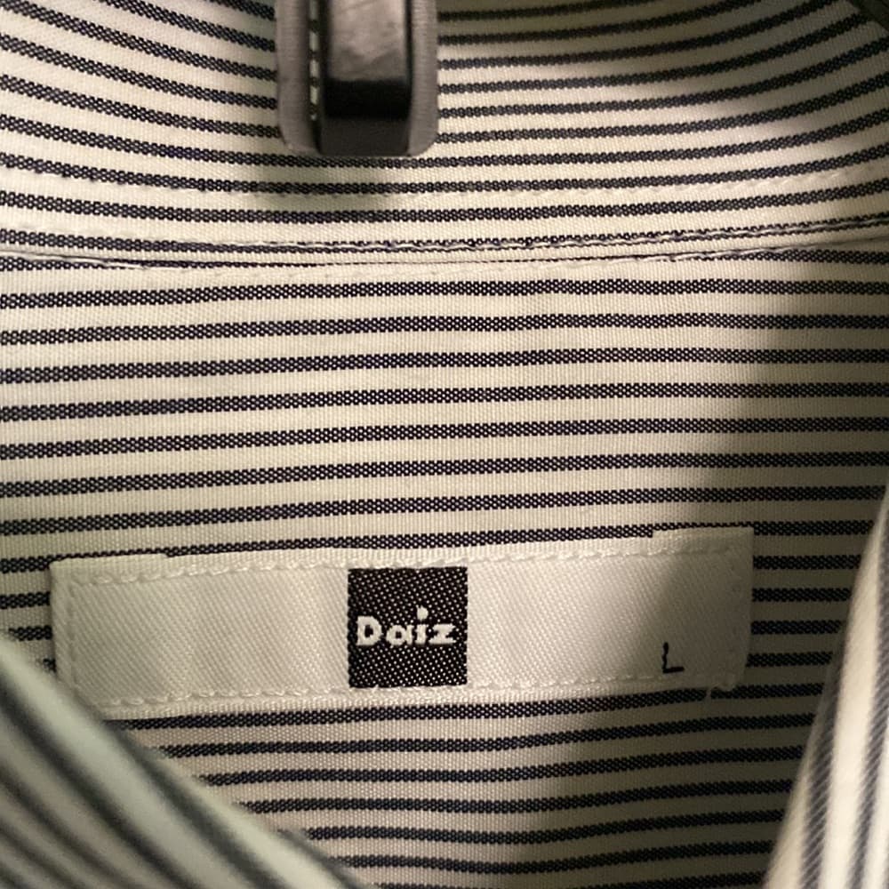 Gray and white striped long sleeve button down shirt