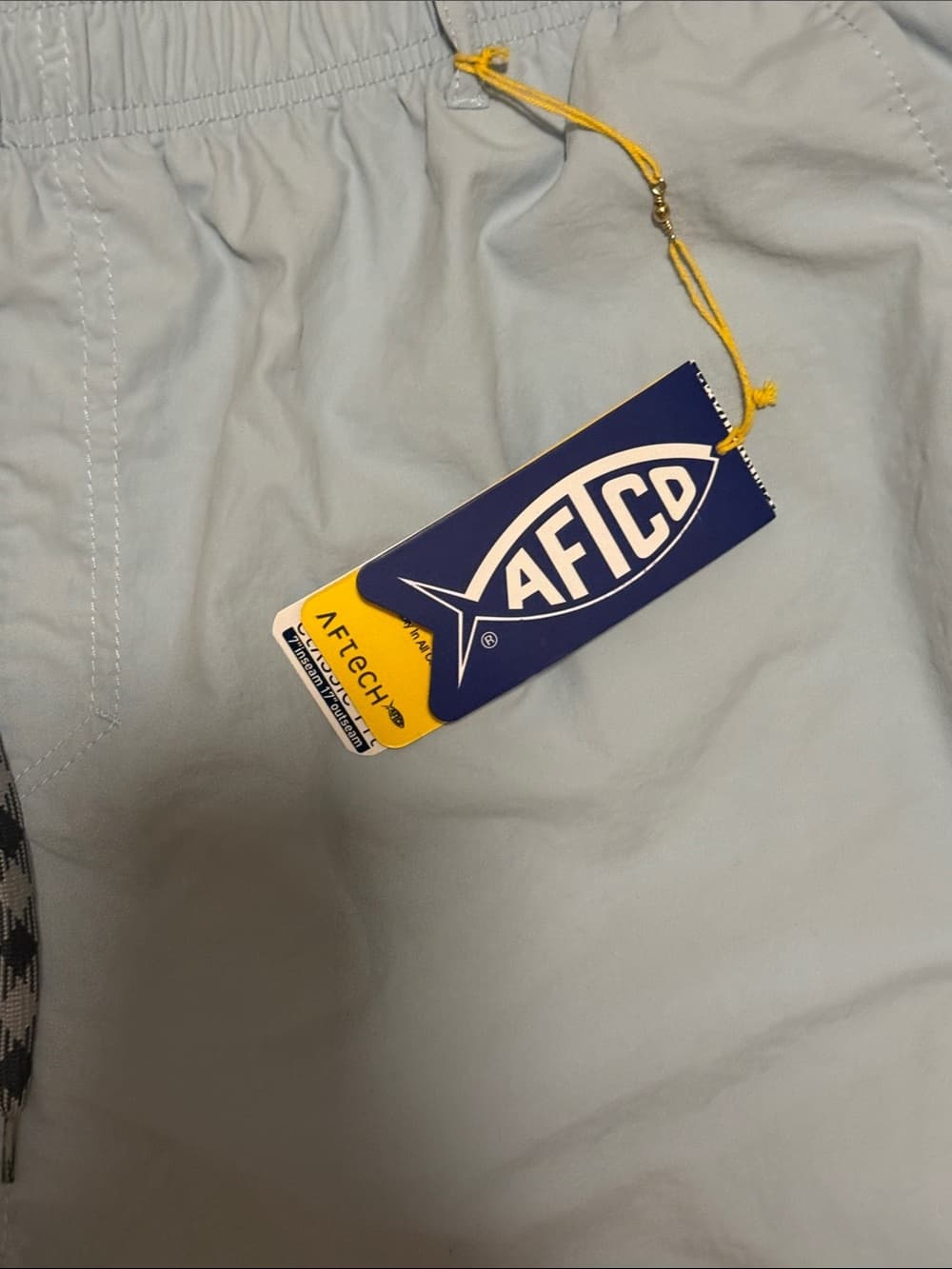 AFTCO Light Blue Men's Swim Shorts with Yellow Drawstring Tag