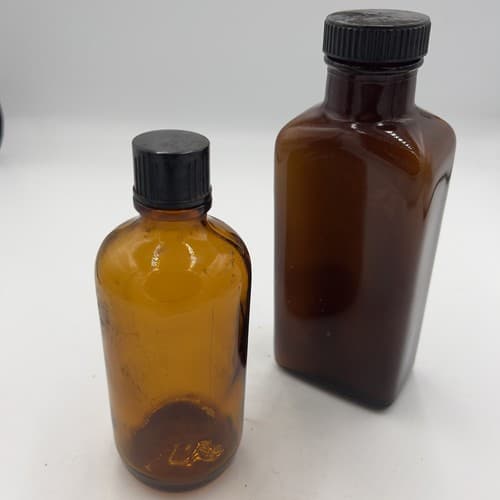 Lot of 2 Early Amber Apothecary Medicine Bottles with lids